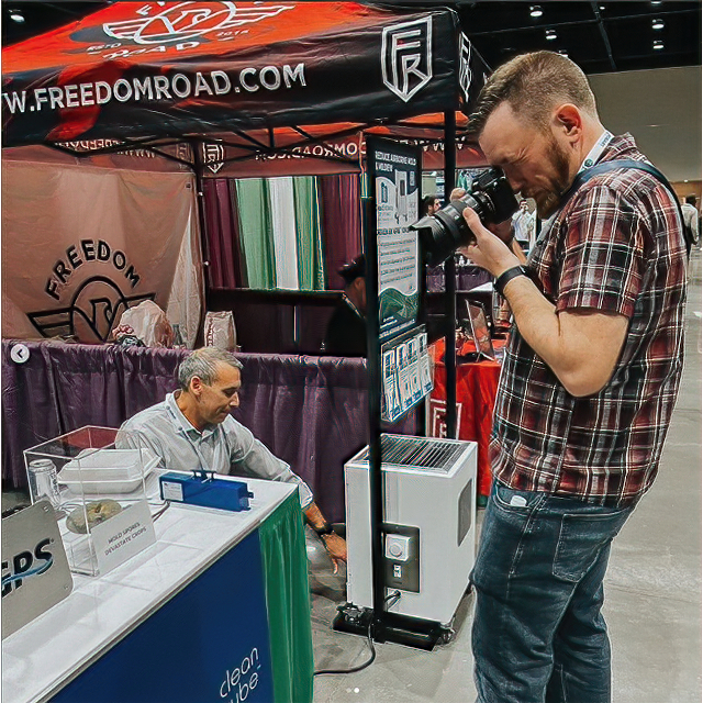 Rick at a conference taking photos